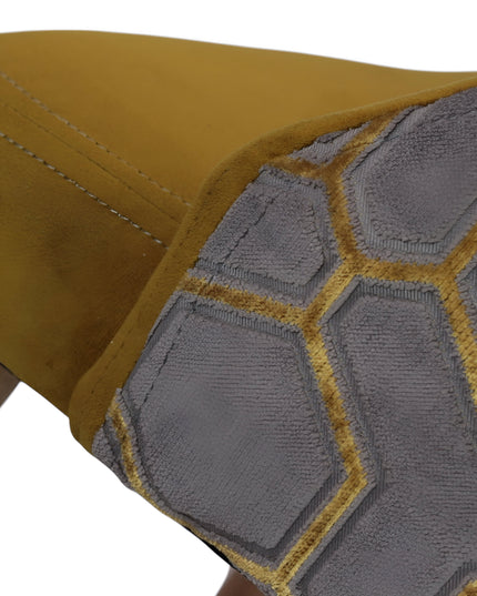 Modern mustard yellow velvet dining chair with wooden legs and gold metal tips, featuring patterned fabric back — ideal for contemporary interiors, dining rooms, or statement seating.