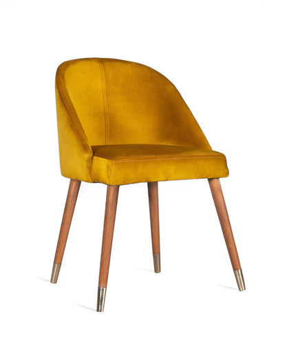 Modern mustard velvet dining chair with wooden legs and golden tips— ideal for contemporary interiors, dining rooms, or statement seating.