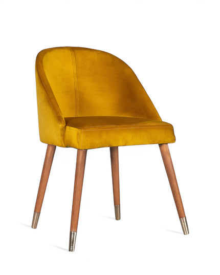 Modern mustard velvet dining chair with wooden legs and golden tips— ideal for contemporary interiors, dining rooms, or statement seating.