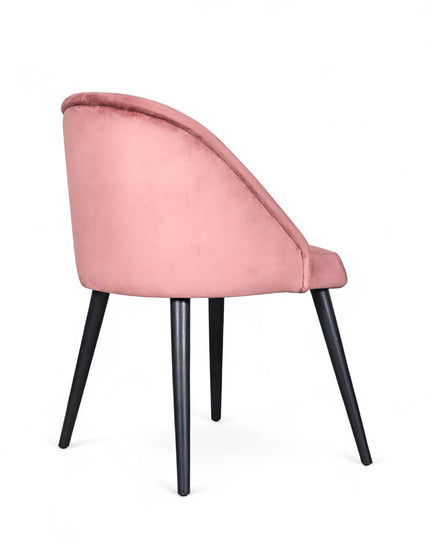 Modern pink velvet dining chair with metal legs— ideal for contemporary interiors, dining rooms, or statement seating.