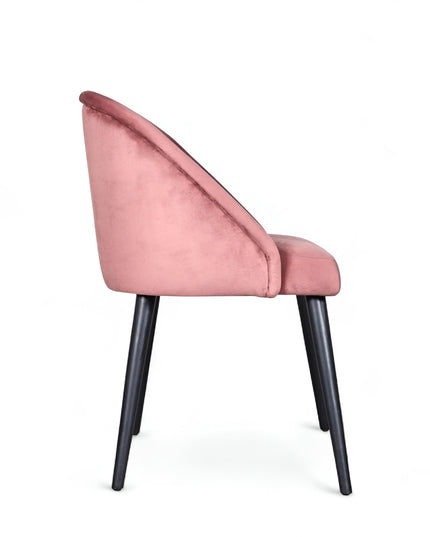 Modern pink velvet dining chair with metal legs— ideal for contemporary interiors, dining rooms, or statement seating.