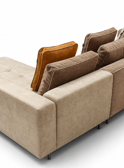 Amberley modern L-shaped sectional sofa with chaise lounge, neutral beige and taupe upholstery, amber accent cushion, included back cushions and slim metal legs.