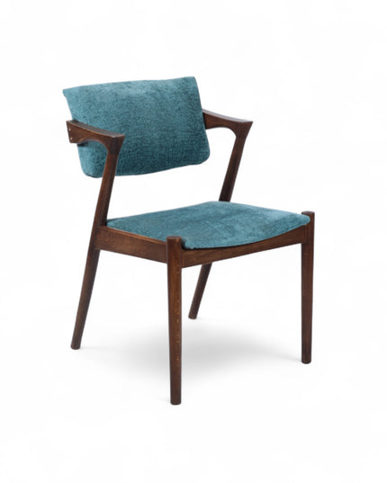 Mid-century modern accent chair with an angular dark wood frame and teal textured upholstery on the seat and backrest, ideal for dining areas, home offices, or stylish living spaces.