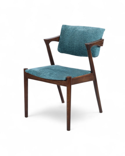 Mid-century modern accent chair with an angular dark wood frame and teal textured upholstery on the seat and backrest, ideal for dining areas, home offices, or stylish living spaces.