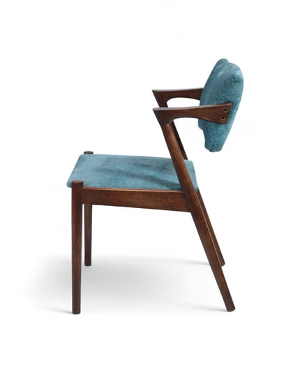 Mid-century modern accent chair with an angular dark wood frame and teal textured upholstery on the seat and backrest, ideal for dining areas, home offices, or stylish living spaces.