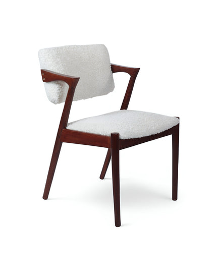 Mid-century modern accent chair featuring an angular dark wood frame and plush white bouclé upholstery on the seat and backrest, perfect for living rooms, reading corners, or contemporary lounge spaces.