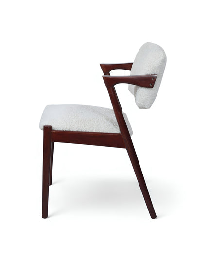 Mid-century modern accent chair featuring an angular dark wood frame and plush white bouclé upholstery on the seat and backrest, perfect for living rooms, reading corners, or contemporary lounge spaces.