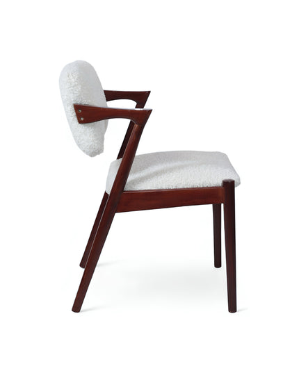 Mid-century modern accent chair featuring an angular dark wood frame and plush white bouclé upholstery on the seat and backrest, perfect for living rooms, reading corners, or contemporary lounge spaces.