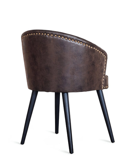 Curved barrel-back eco leather chair with nailhead trim and four tapered legs

