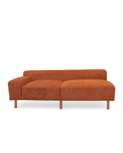 Modern orange modular sofa with two deep-seating sections, ergonomic spring cushions, and elevated wooden legs designed for lounging and easy cleaning