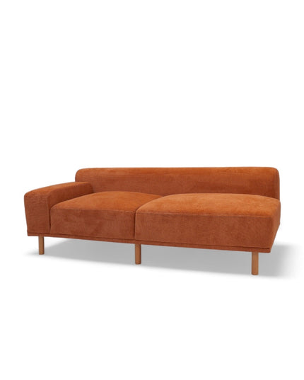 Modern orange modular sofa with two deep-seating sections, ergonomic spring cushions, and elevated wooden legs designed for lounging and easy cleaning