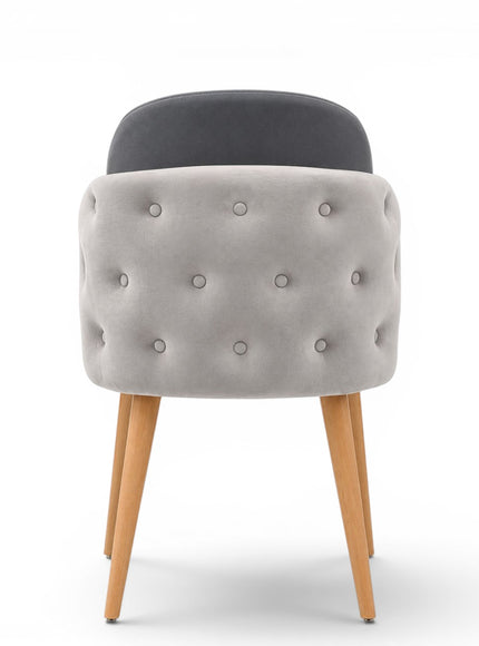 A modern gray upholstered dining chair with a tufted button backrest, nailhead trim, and tapered light wood legs, shown on a white background.
