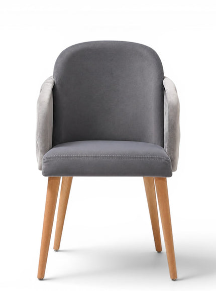 A modern gray upholstered dining chair with a tufted button backrest, nailhead trim, and tapered light wood legs, shown on a white background.