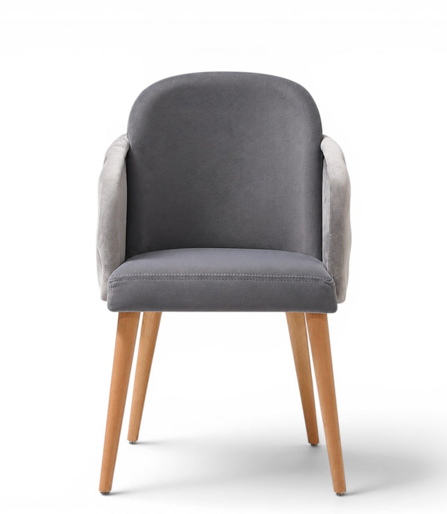 A modern gray upholstered dining chair with a tufted button backrest, nailhead trim, and tapered light wood legs, shown on a white background.