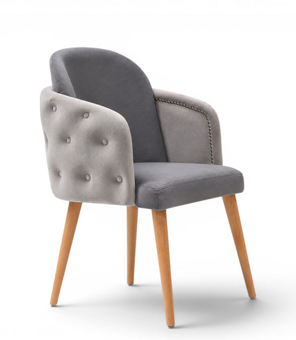 A modern gray upholstered dining chair with a tufted button backrest, nailhead trim, and tapered light wood legs, shown on a white background.