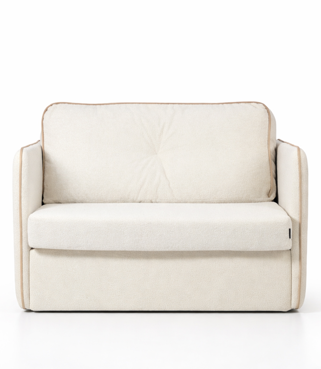 Off-white upholstered armchair with boucle texture and beige piping, shown against a clean white background