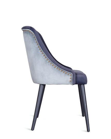 Contemporary side chair with two colors of blue curved backrest, studded trim, and black tapered legs