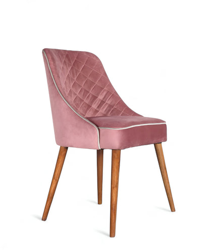 Contemporary side chair with pink curved backrest, studded trim, and wooden legs