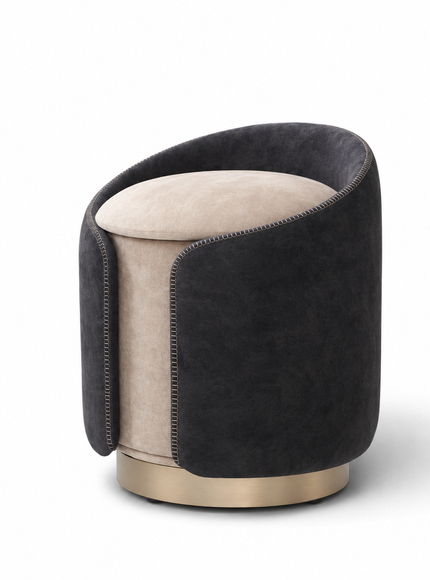 A modern cylindrical ottoman stool with a dark charcoal gray velvet outer sleeve, a light beige velvet seat cushion, and a brushed gold metal base, shown on a white background.