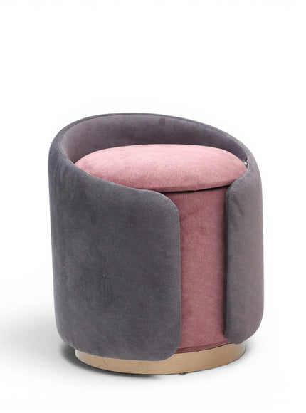 A cylindrical upholstered ottoman or stool in dusty grey velvet, featuring a light natural wood base, shown against a plain white background.