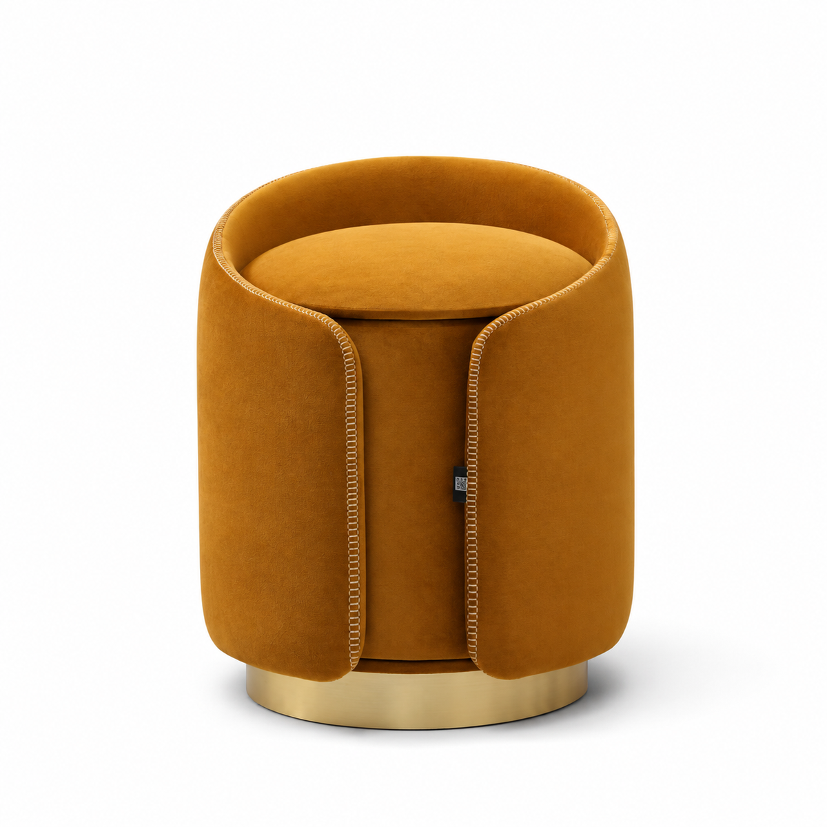 A modern cylindrical velvet stool in a warm mustard yellow color, featuring a gold metal base and decorative stitching along the front panels, set against a plain white background.
