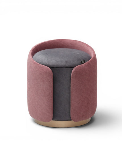 A cylindrical upholstered ottoman or stool in dusty rose pink velvet, featuring a light natural wood base, shown against a plain white background.