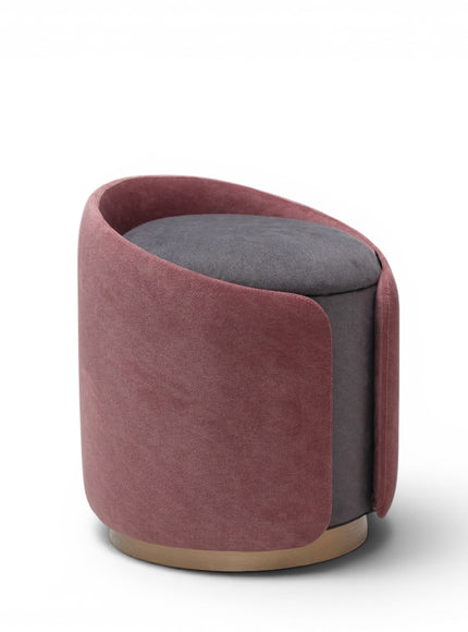 A cylindrical upholstered ottoman or stool in dusty rose pink velvet, featuring a light natural wood base, shown against a plain white background.