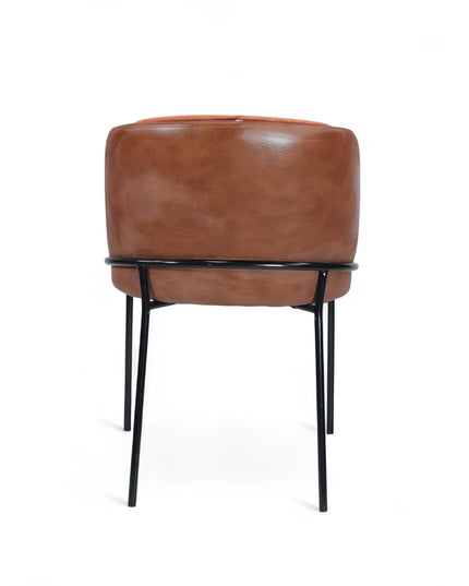 Modern terracotta velvet and leather accent chair with black metal legs — ideal for dining rooms, stylish interiors, or contemporary cafes seeking warmth and contrast.