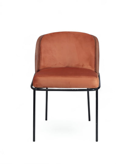 Modern terracotta velvet and leather accent chair with black metal legs — ideal for dining rooms, stylish interiors, or contemporary cafes seeking warmth and contrast.