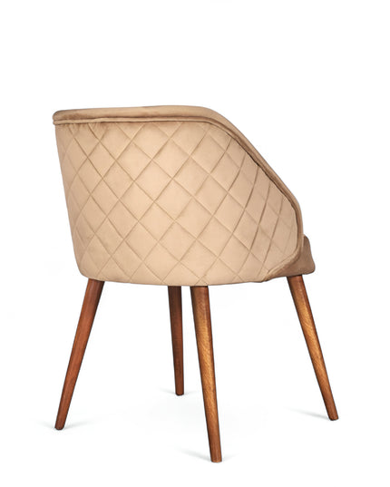 Modern quilted beige accent chair with wraparound back, low arms, and wooden tapered legs
