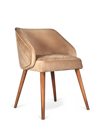 Modern quilted beige accent chair with wraparound back, low arms, and wooden tapered legs
