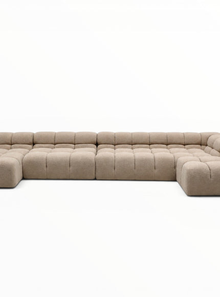 Beige sectional sofa on a white background