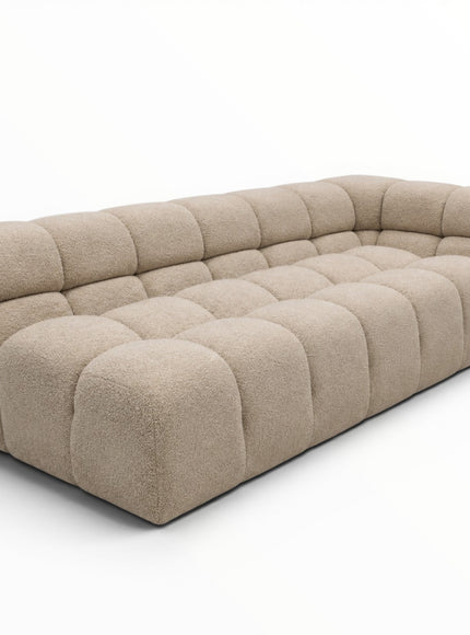 Beige sectional sofa on a white background