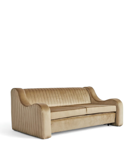 Cappuccino Sofa Bed in warm camel velvet with sculpted curved arms, vertical channel tufting, and hidden pull-out bed; shown in sofa position, full bed mode, and front view.