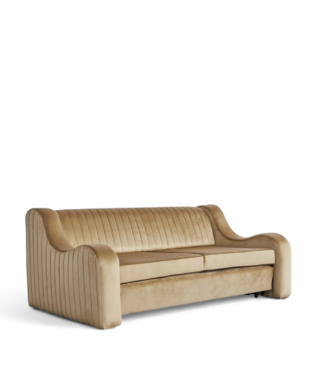 Cappuccino Sofa Bed in warm camel velvet with sculpted curved arms, vertical channel tufting, and hidden pull-out bed; shown in sofa position, full bed mode, and front view.