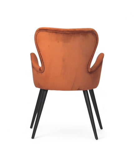 Mid-century modern burnt orange velvet accent chair with black metal legs, ideal for living room or office decor.