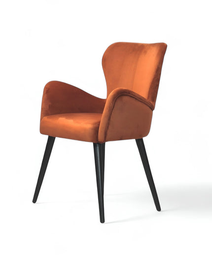 Mid-century modern burnt orange velvet accent chair with black metal legs, ideal for living room or office decor.
