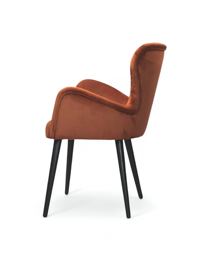 Mid-century modern burnt orange velvet accent chair with black metal legs, ideal for living room or office decor.