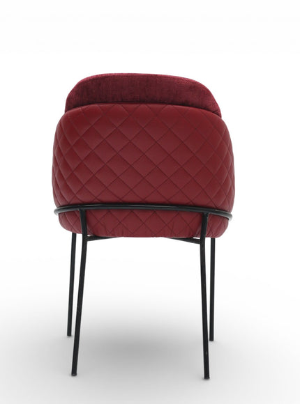 Red quilted chair with black metal legs on a white background