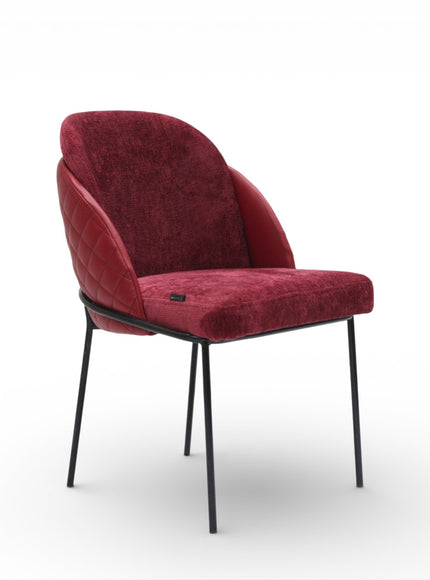 Red upholstered chair with black legs on a white background