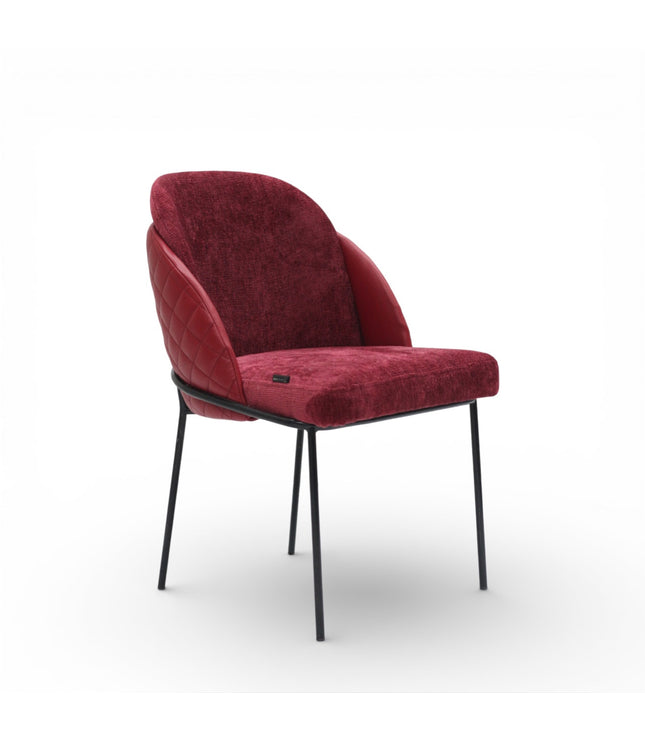 Red upholstered chair with black legs on a white background