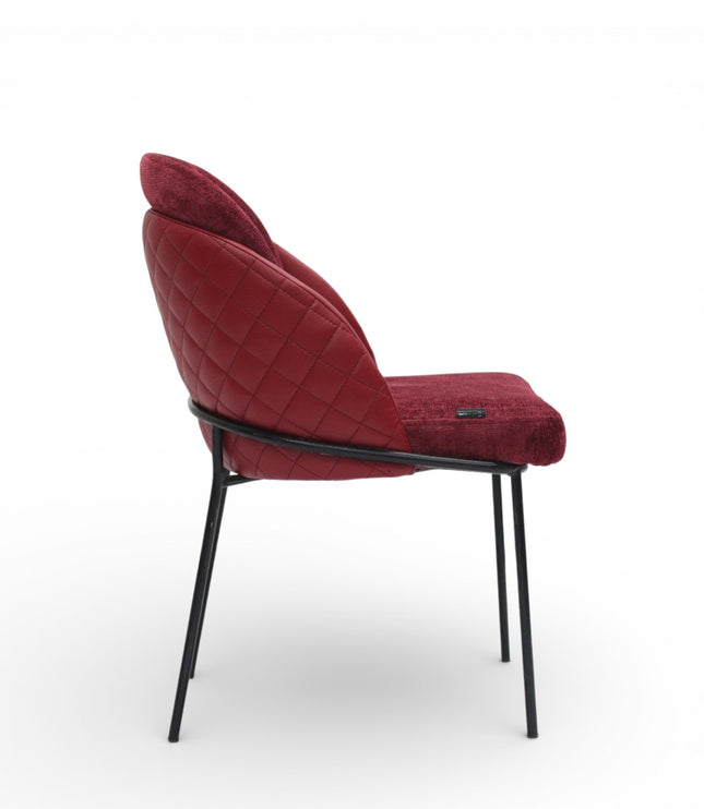 Red upholstered chair with black metal legs on a white background
