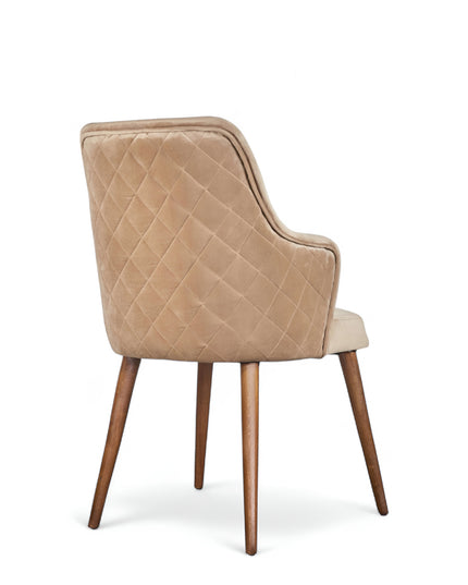 Beige upholstered armchair with high back, quilted sides, and wooden legs in a mid-century modern style