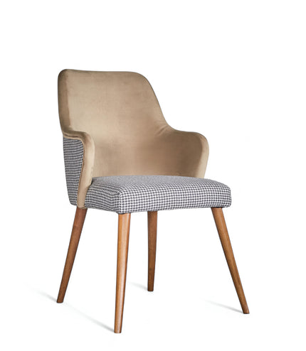 Houndstooth/beige upholstered armchair with high back, quilted sides, and wooden legs in a mid-century modern style