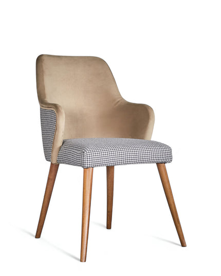Houndstooth/beige upholstered armchair with high back, quilted sides, and wooden legs in a mid-century modern style