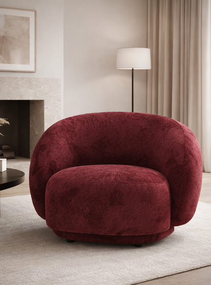 Raspberry embossed Cloud Armchair with a rounded, armless design and swivel base, offering a plush, sculptural look from front and angled views. staged