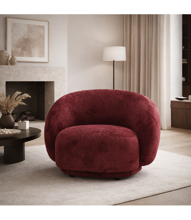 Raspberry embossed Cloud Armchair with a rounded, armless design and swivel base, offering a plush, sculptural look from front and angled views. staged