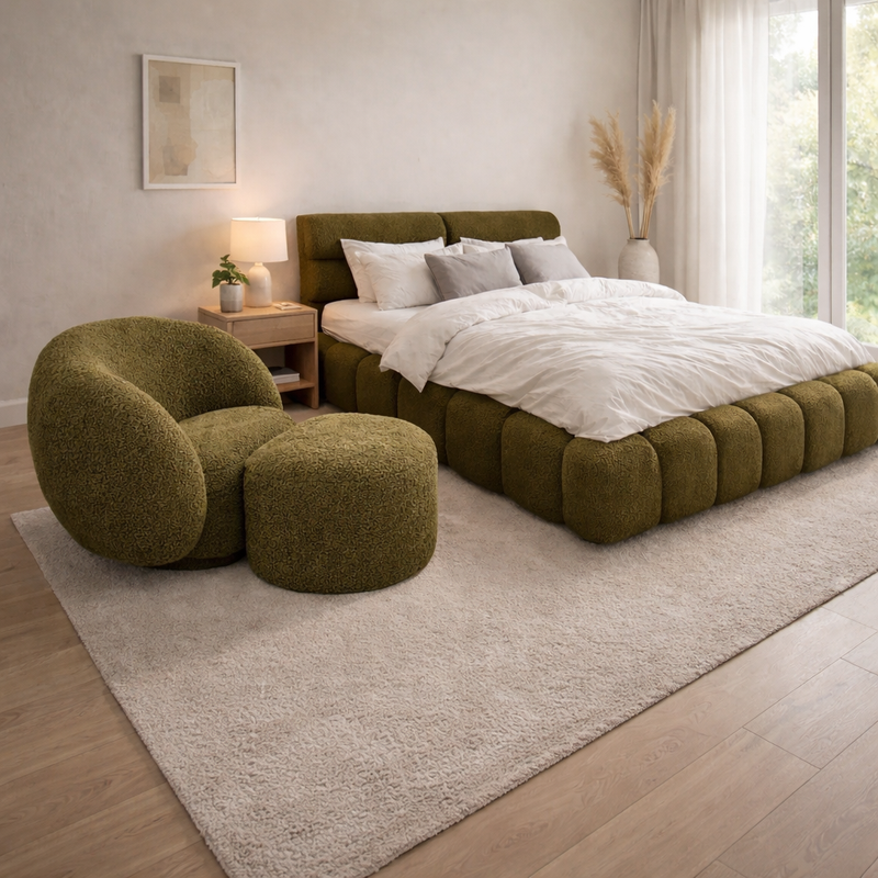 green cushioned seat and a green bed in a bedroom
