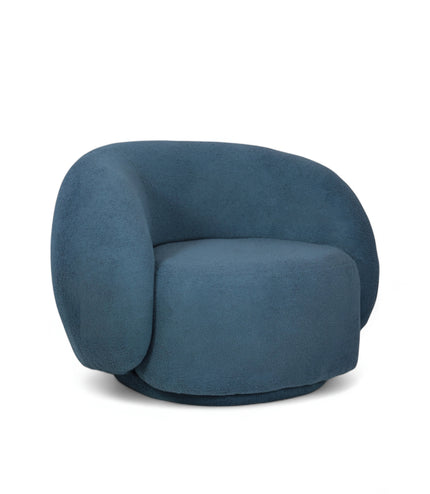 Deep blue boucle Cloud Armchair with a rounded, armless design and swivel base, offering a plush, sculptural look from front and angled views.