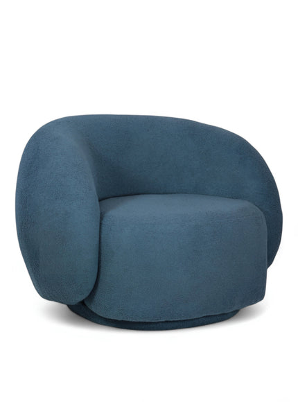 Deep blue boucle Cloud Armchair with a rounded, armless design and swivel base, offering a plush, sculptural look from front and angled views.